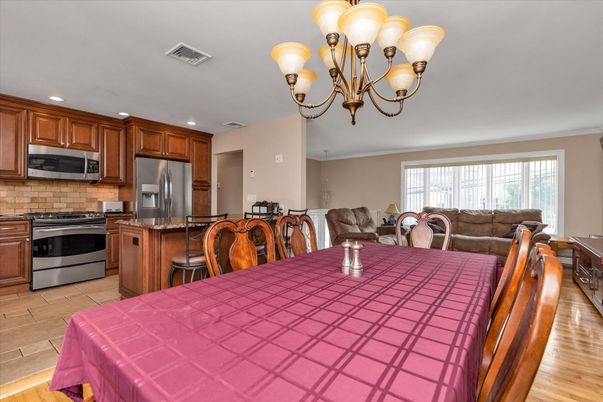 Chandelier, Dining room, Interior, Kitchen, Recessed Lighting, Stainless Steel Appliances, Wood Texture Flooring
