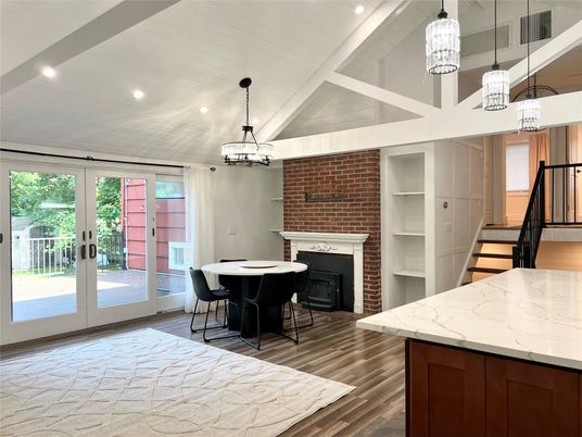 Chandelier, Dining room, Fireplace, Interior, Pendant Lights, Recessed Lighting, Stone Walls, Wood Texture Flooring