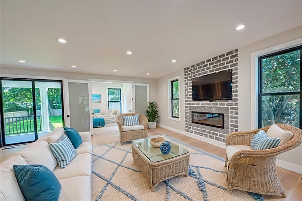 Fireplace, Interior, Living room, Recessed Lighting, Stone Walls, Wood Texture Flooring