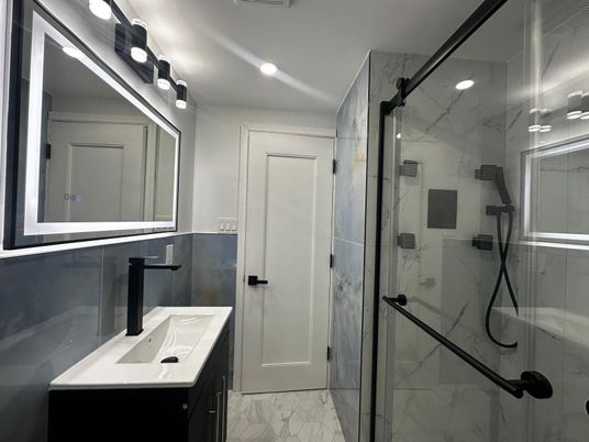 Bathroom, Dual Sink Vanities, Glass Shower, Interior, Marble, Marble Walls, Recessed Lighting