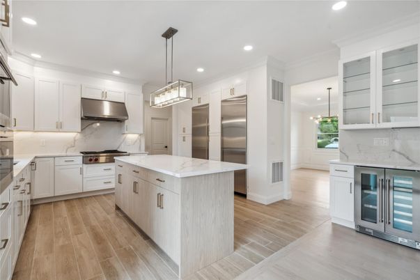 Interior, Kitchen, Marble Walls, Pendant Lights, Recessed Lighting, Stainless Steel Appliances, Wood Texture Flooring