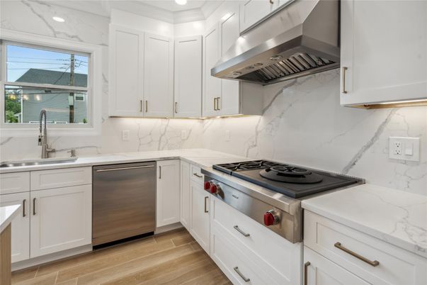 Interior, Kitchen, Marble Walls, Recessed Lighting, Stainless Steel Appliances, Wood Texture Flooring