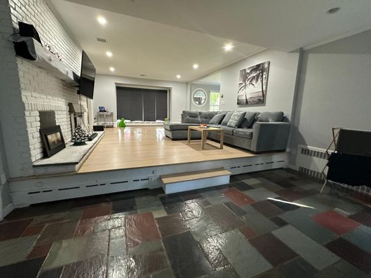 Fireplace, Interior, Living room, Recessed Lighting, Stone Walls, Wood Texture Flooring