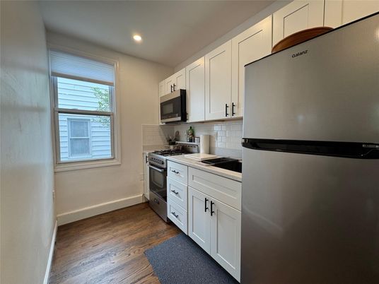 Interior, Kitchen, Recessed Lighting, Stainless Steel Appliances, Wood Texture Flooring