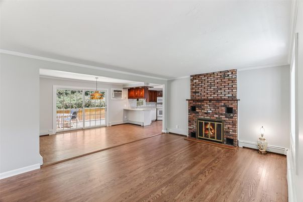 Empty room, Fireplace, Interior, Kitchen, Pendant Lights, Stone Walls, Wood Texture Flooring