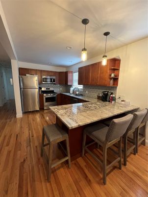 Dining room, Interior, Kitchen, Pendant Lights, Recessed Lighting, Stainless Steel Appliances, Wood Texture Flooring