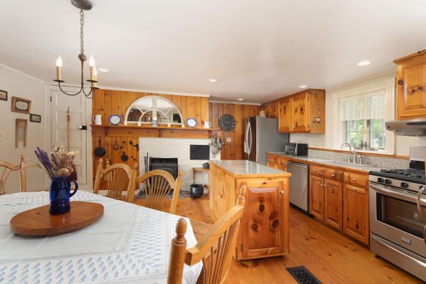 Dining room, Interior, Kitchen, Pendant Lights, Recessed Lighting, Stainless Steel Appliances, Wood Texture Flooring
