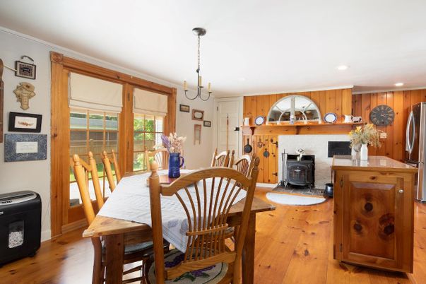 Chandelier, Dining room, Fireplace, Interior, Kitchen, Recessed Lighting, Wood Texture Flooring