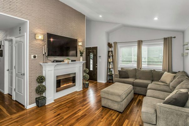 Fireplace, Interior, Living room, Recessed Lighting, Stone Walls, Wood Texture Flooring