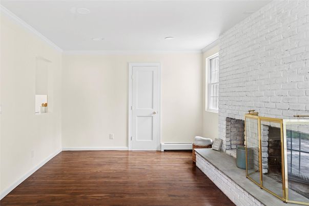Empty room, Fireplace, Interior, Recessed Lighting, Stone Walls, Wood Texture Flooring