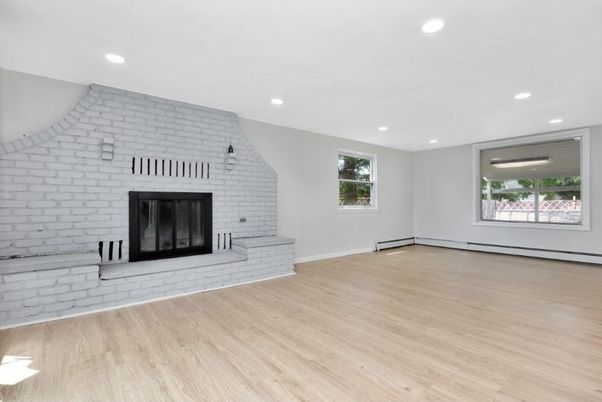 Empty room, Fireplace, Interior, Recessed Lighting, Stone Walls, Wood Texture Flooring