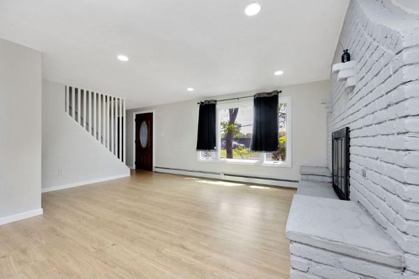 Empty room, Fireplace, Interior, Recessed Lighting, Stone Walls, Wood Texture Flooring
