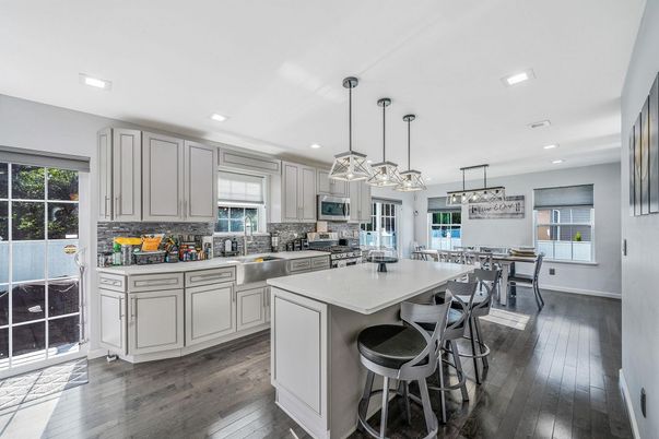 Dining room, Interior, Kitchen, Pendant Lights, Recessed Lighting, Stainless Steel Appliances, Wood Texture Flooring