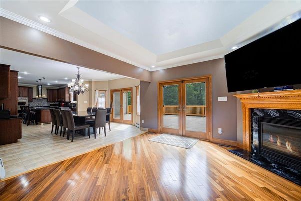 Chandelier, Dining room, Fireplace, Interior, Kitchen, Recessed Lighting, Wood Texture Flooring