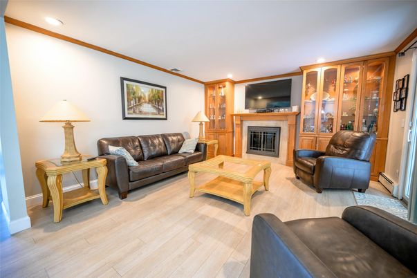 Fireplace, Interior, Living room, Recessed Lighting, Wood Texture Flooring