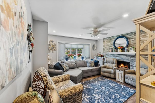 Fireplace, Interior, Living room, Recessed Lighting, Stone Walls, Wood Texture Flooring