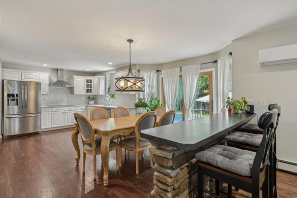 Dining room, Interior, Kitchen, Pendant Lights, Recessed Lighting, Stainless Steel Appliances, Wood Texture Flooring