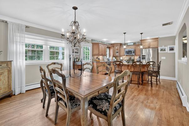 Chandelier, Dining room, Interior, Kitchen, Pendant Lights, Stainless Steel Appliances, Wood Texture Flooring