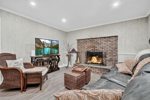 Fireplace, Interior, Living room, Recessed Lighting, Stone Walls, Wood Texture Flooring