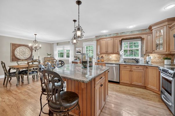 Chandelier, Dining room, Interior, Kitchen, Pendant Lights, Recessed Lighting, Stainless Steel Appliances, Wood Texture Flooring