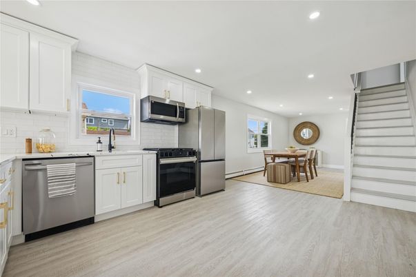 Dining room, Interior, Kitchen, Recessed Lighting, Stainless Steel Appliances, Wood Texture Flooring