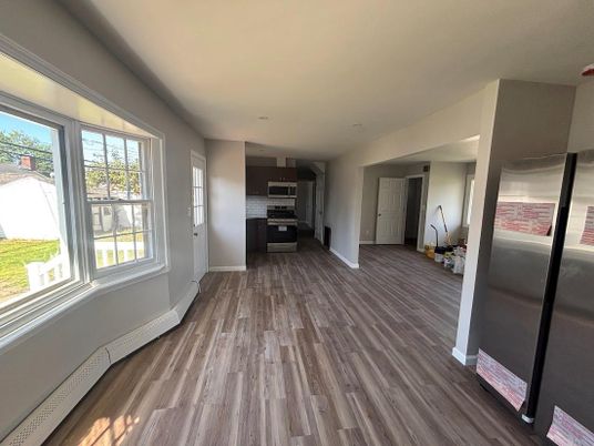 Empty room, Interior, Kitchen, Stainless Steel Appliances, Wood Texture Flooring