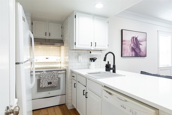 Interior, Kitchen, Recessed Lighting, Tile Countertops, Wood Texture Flooring