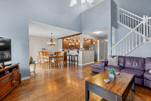 Chandelier, Dining room, Interior, Kitchen, Living room, Pendant Lights, Stainless Steel Appliances, Wood Texture Flooring