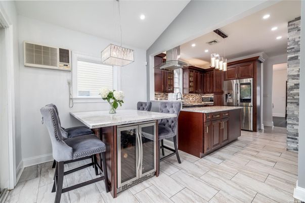 Chandelier, Dining room, Interior, Kitchen, Pendant Lights, Recessed Lighting, Stainless Steel Appliances, Wood Texture Flooring