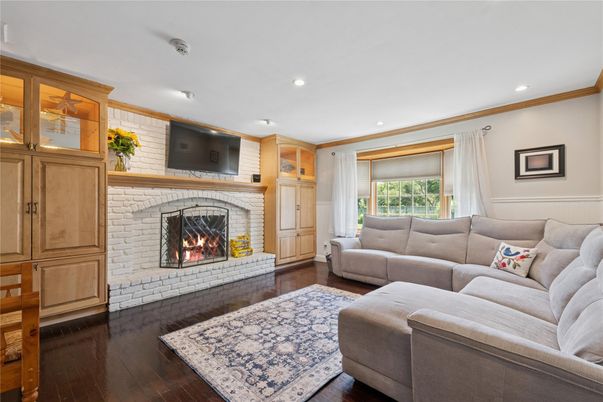 Fireplace, Interior, Living room, Recessed Lighting, Stone Walls, Wood Texture Flooring