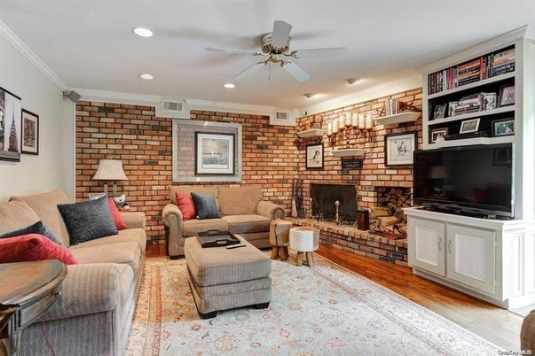 Fireplace, Interior, Living room, Recessed Lighting, Stone Walls, Wood Texture Flooring