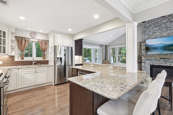 Fireplace, Interior, Kitchen, Recessed Lighting, Stainless Steel Appliances, Stone Walls, Wood Texture Flooring