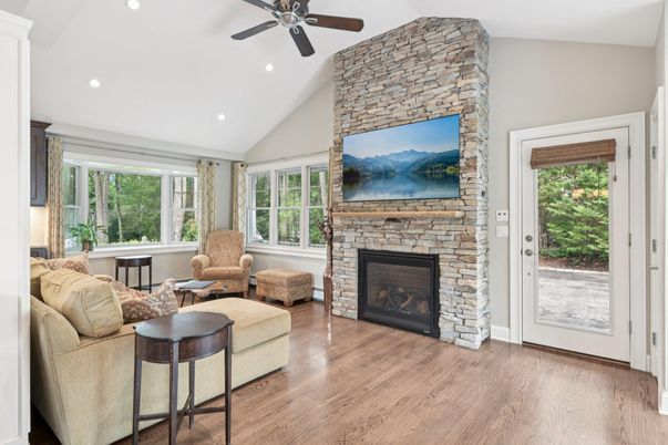 Fireplace, Interior, Living room, Recessed Lighting, Stone Walls, Wood Texture Flooring