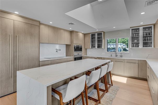 Interior, Kitchen, Marble Walls, Recessed Lighting, Stainless Steel Appliances, Wood Texture Flooring