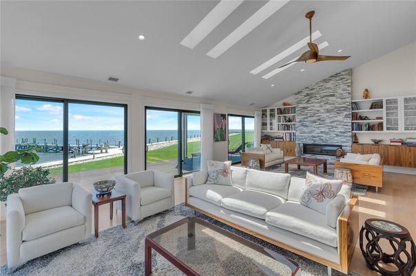 Fireplace, Interior, Living room, Recessed Lighting, Stone Walls, Water, Wood Texture Flooring