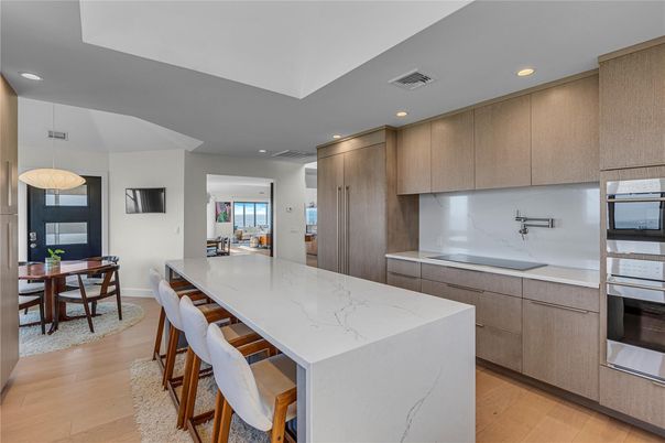 Dining room, Interior, Kitchen, Pendant Lights, Recessed Lighting, Stainless Steel Appliances, Wood Texture Flooring