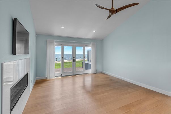 Empty room, Fireplace, Interior, Recessed Lighting, Water, Wood Texture Flooring