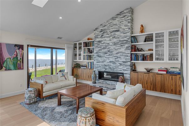 Fireplace, Interior, Living room, Recessed Lighting, Stone Walls, Water, Wood Texture Flooring