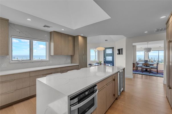 Dining room, Interior, Kitchen, Recessed Lighting, Stainless Steel Appliances, Water, Wood Texture Flooring