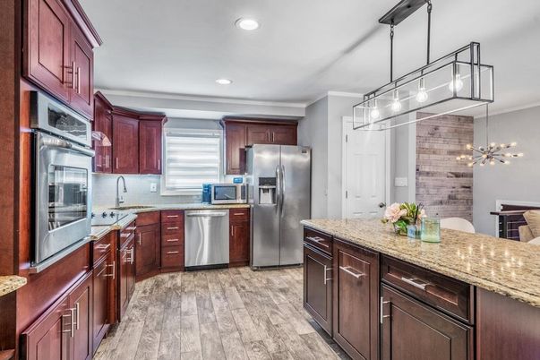 Interior, Kitchen, Pendant Lights, Recessed Lighting, Stainless Steel Appliances, Stone Walls, Wood Texture Flooring