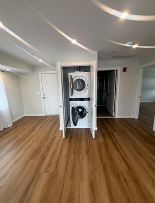 Empty room, Interior, Recessed Lighting, Utility Closets, Washer, Wood Texture Flooring