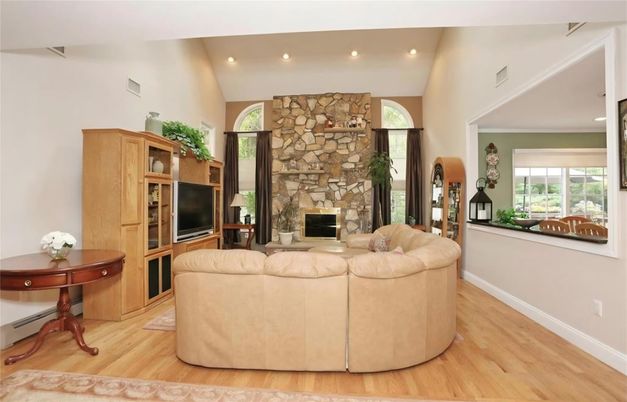 Fireplace, Interior, Living room, Recessed Lighting, Stone Walls, Wood Texture Flooring
