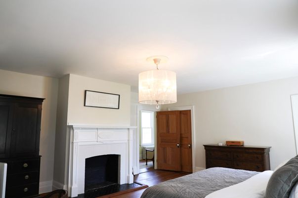 Bedroom, Chandelier, Fireplace, Interior, Wood Texture Flooring