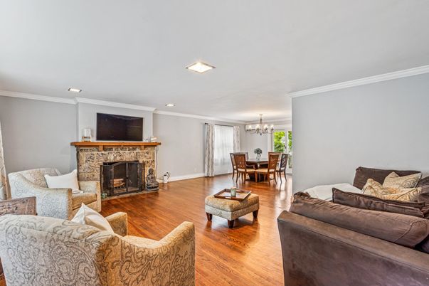Chandelier, Dining room, Fireplace, Interior, Living room, Recessed Lighting, Wood Texture Flooring