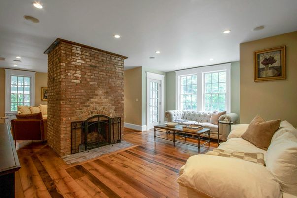 Fireplace, Interior, Living room, Recessed Lighting, Stone Walls, Wood Texture Flooring