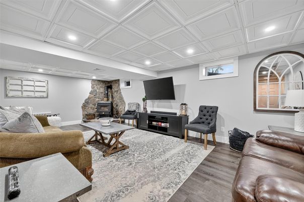 Fireplace, Interior, Living room, Recessed Lighting, Stone Walls, Wood Texture Flooring
