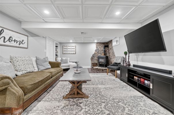 Fireplace, Interior, Living room, Recessed Lighting, Stone Walls, Wood Texture Flooring