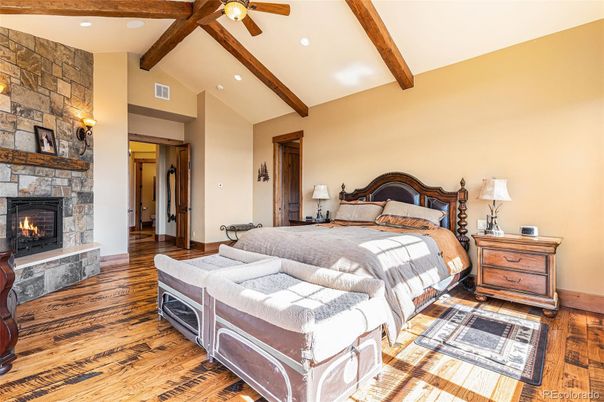 Bedroom, Fireplace, Interior, Recessed Lighting, Stone Walls, Wooden Beams, Wood Texture Flooring