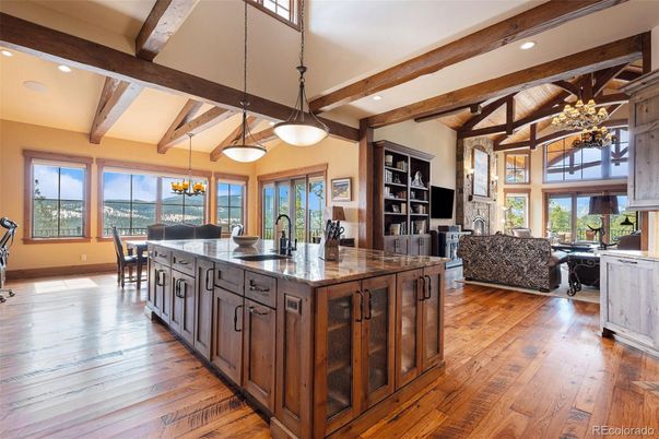 Chandelier, Dining room, Interior, Kitchen, Living room, Pendant Lights, Recessed Lighting, Wooden Beams, Wood Texture Flooring