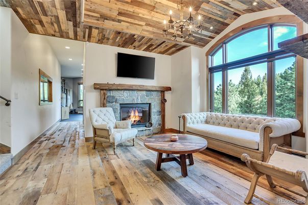 Chandelier, Fireplace, Interior, Living room, Recessed Lighting, Wooden Ceilings, Wood Texture Flooring
